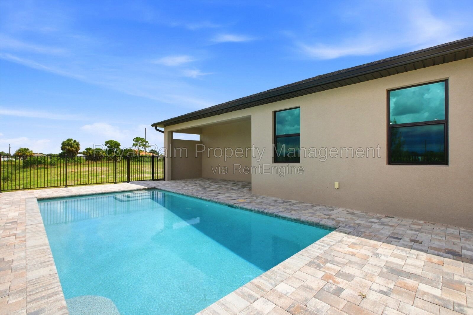 New 3/2 Pool Home for Rent on Canal, Fenced Yard, Pets Welcome. Your Dog Approves of This Backyard property image