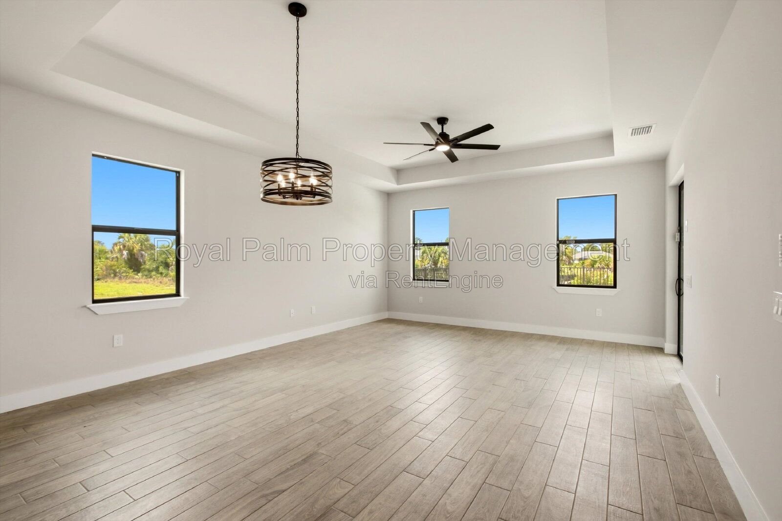 New 3/2 Pool Home for Rent on Canal, Fenced Yard, Pets Welcome. Your Dog Approves of This Backyard property image