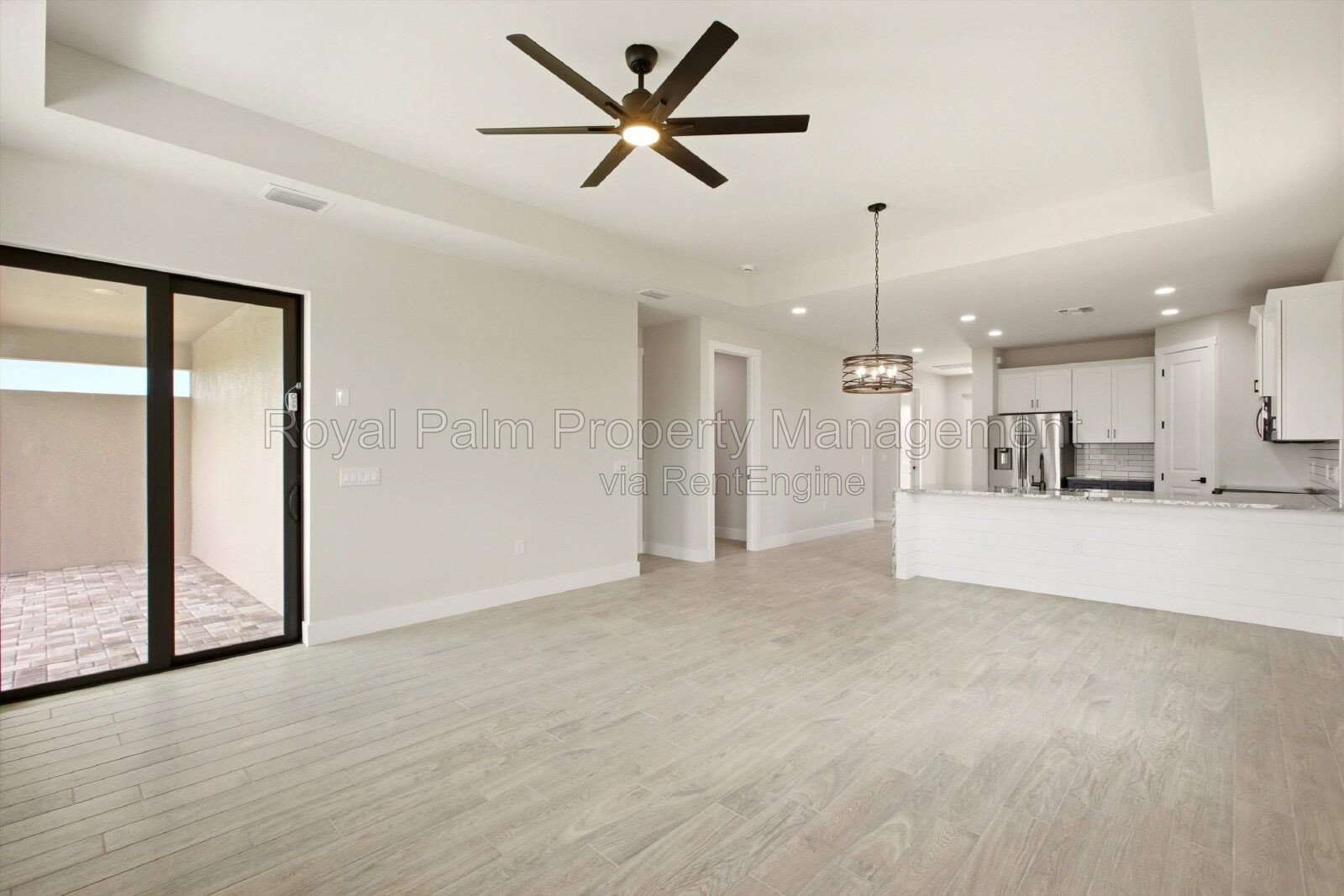 New 3/2 Pool Home for Rent on Canal, Fenced Yard, Pets Welcome. Your Dog Approves of This Backyard property image