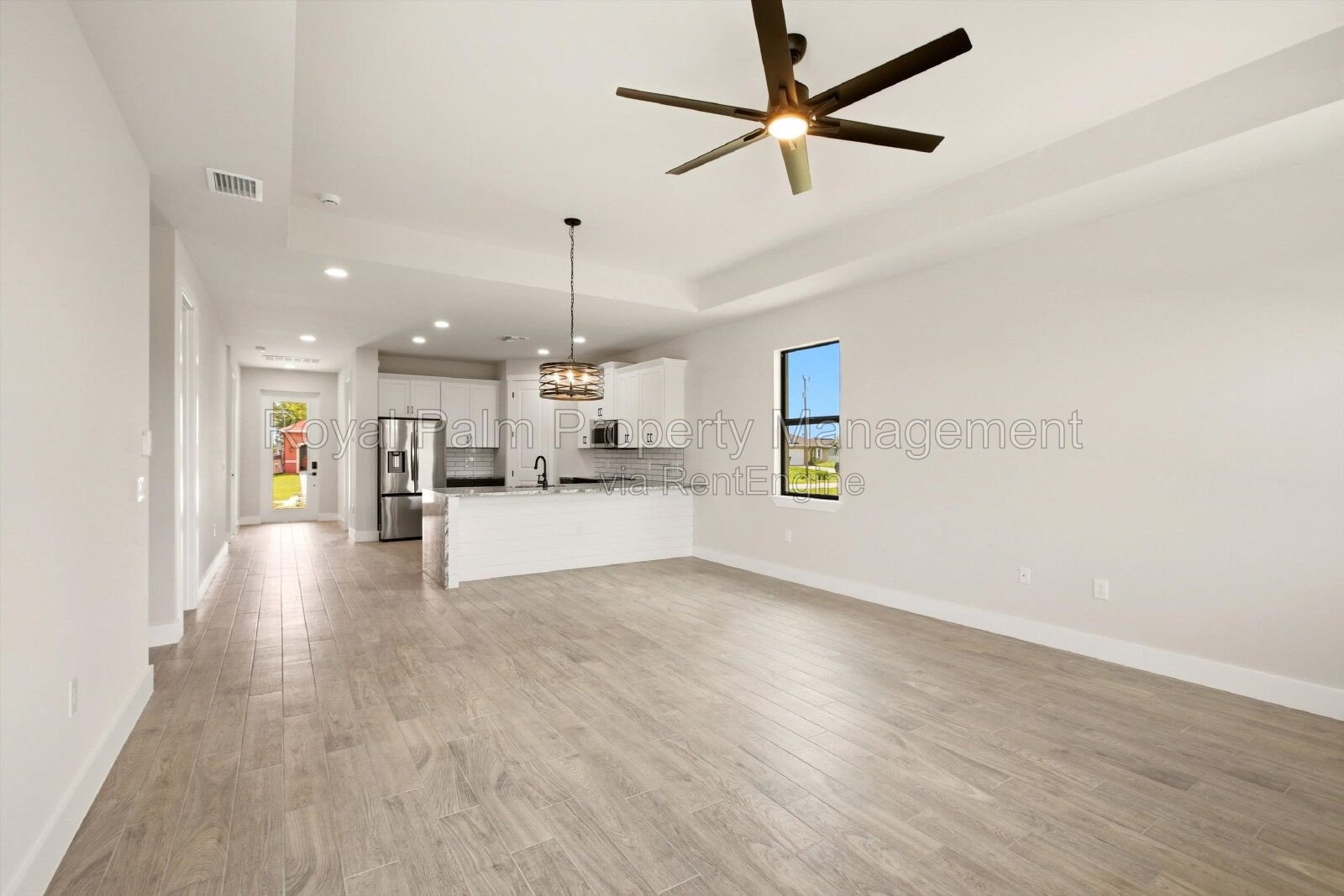 New 3/2 Pool Home for Rent on Canal, Fenced Yard, Pets Welcome. Your Dog Approves of This Backyard property image