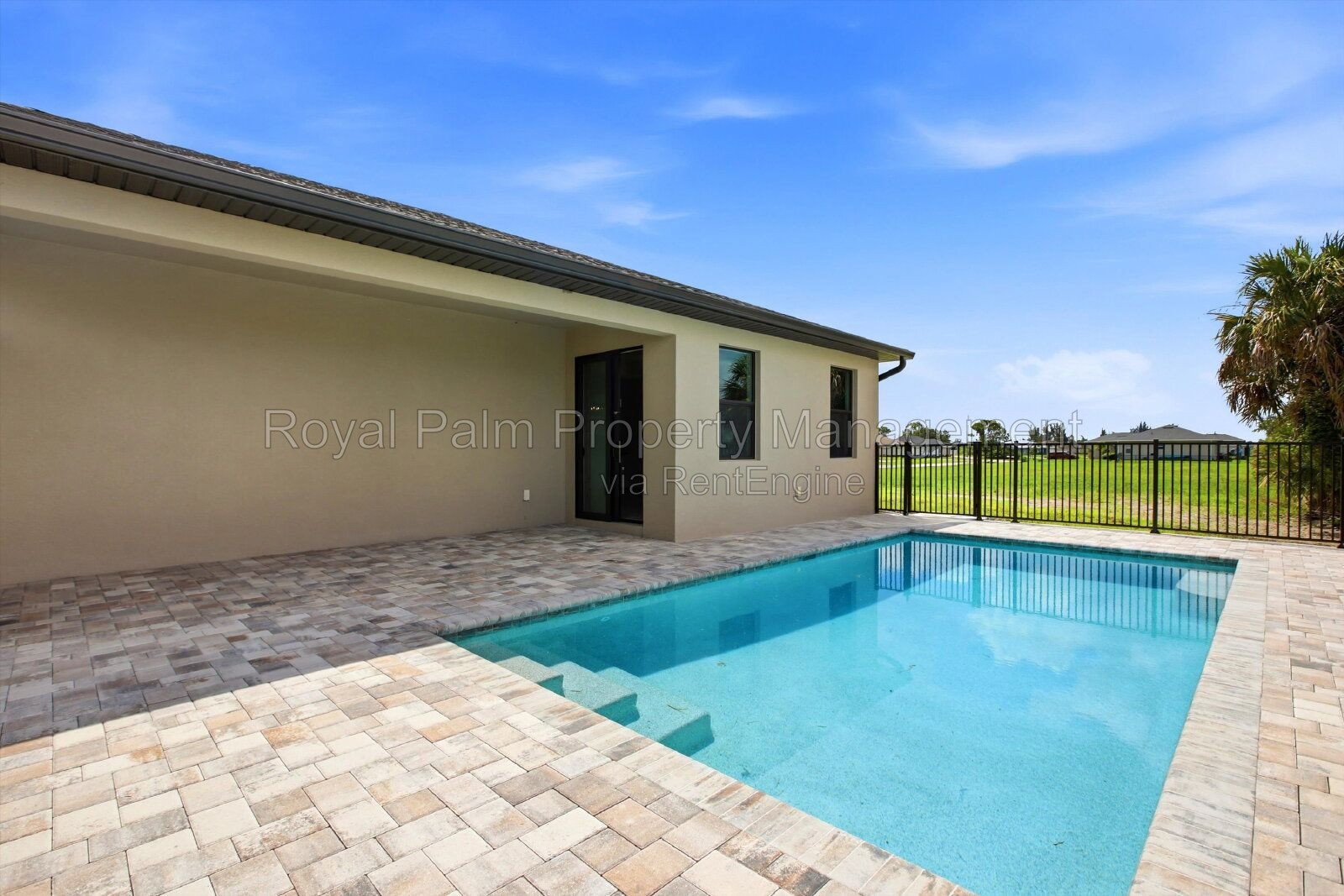 New 3/2 Pool Home for Rent on Canal, Fenced Yard, Pets Welcome. Your Dog Approves of This Backyard property image