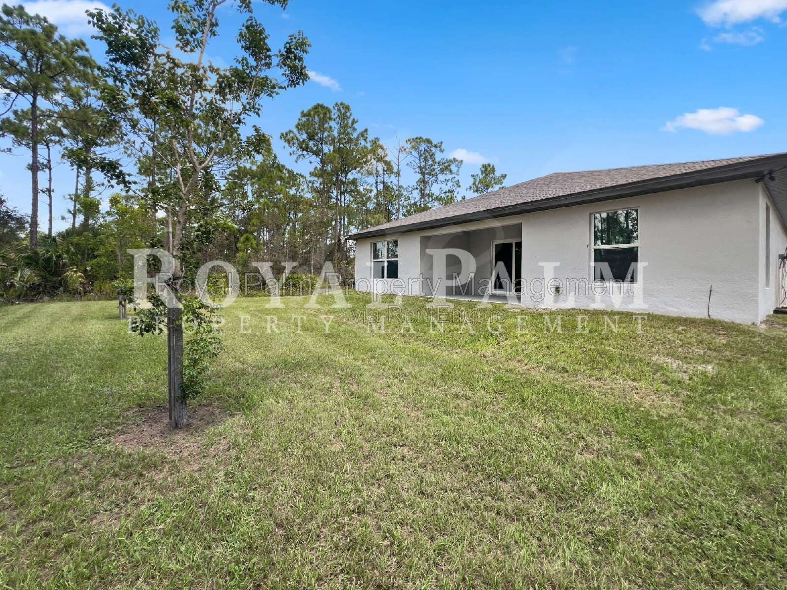 Laundry Room, 2-Car Garage, Room to Roam | 4-Bedroom Lehigh Acres Home property image