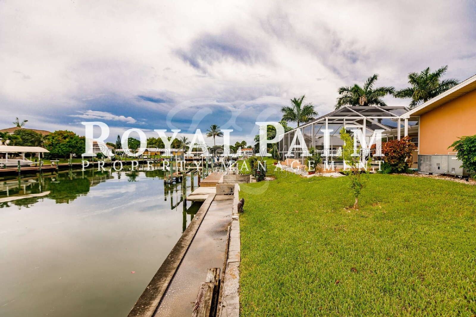 3/2 Home with Gulf Access, Lawn, & Pool Included... Water You Waiting For! property image