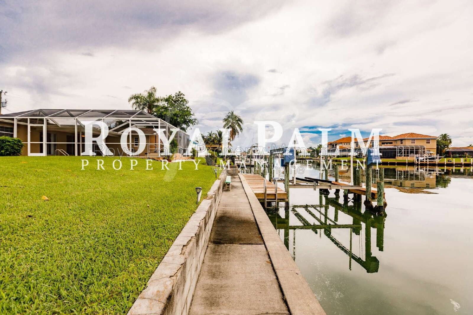 3/2 Home with Gulf Access, Lawn, & Pool Included... Water You Waiting For! property image